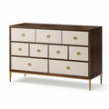 Commode en bois avec façades en lin beige et pieds métalliques dorés